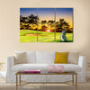 Golf equipment on green and hole as background Multi Panel Canvas Wall Art