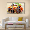 Assorted dry fruits raisins apricots figs prunes goji cranberries on a wooden background, Multi panel canvas wall art