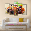 Assorted dry fruits raisins apricots figs prunes goji cranberries on a wooden background, Multi panel canvas wall art