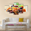 Assorted dry fruits raisins apricots figs prunes goji cranberries on a wooden background, Multi panel canvas wall art