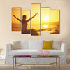 Yoga at sunset on the beach woman doing yoga performing Multi panel canvas wall art