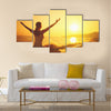 Yoga at sunset on the beach woman doing yoga performing Multi panel canvas wall art