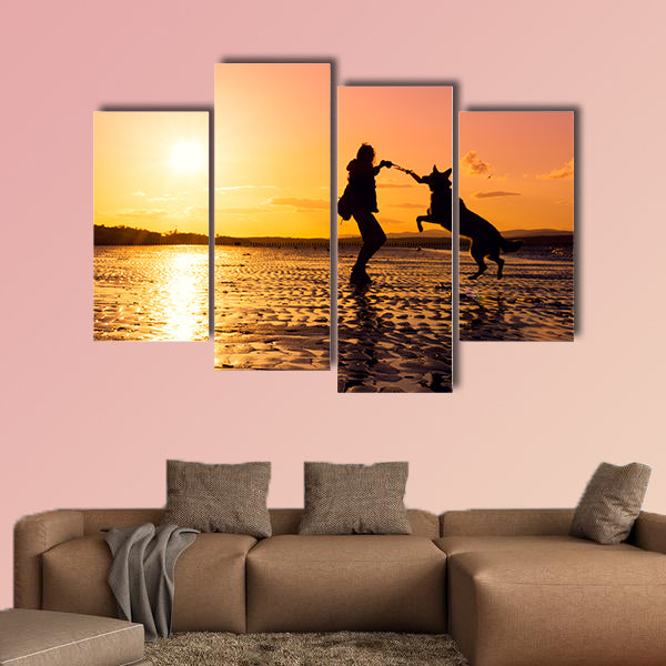 Hipster girl playing with dog at a beach during sunset, wall art