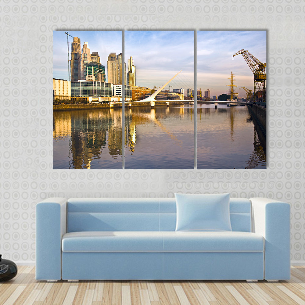 Scene Of A Lake Flowing In Front Of Yellow Building Multi Panel Canvas Wall Art