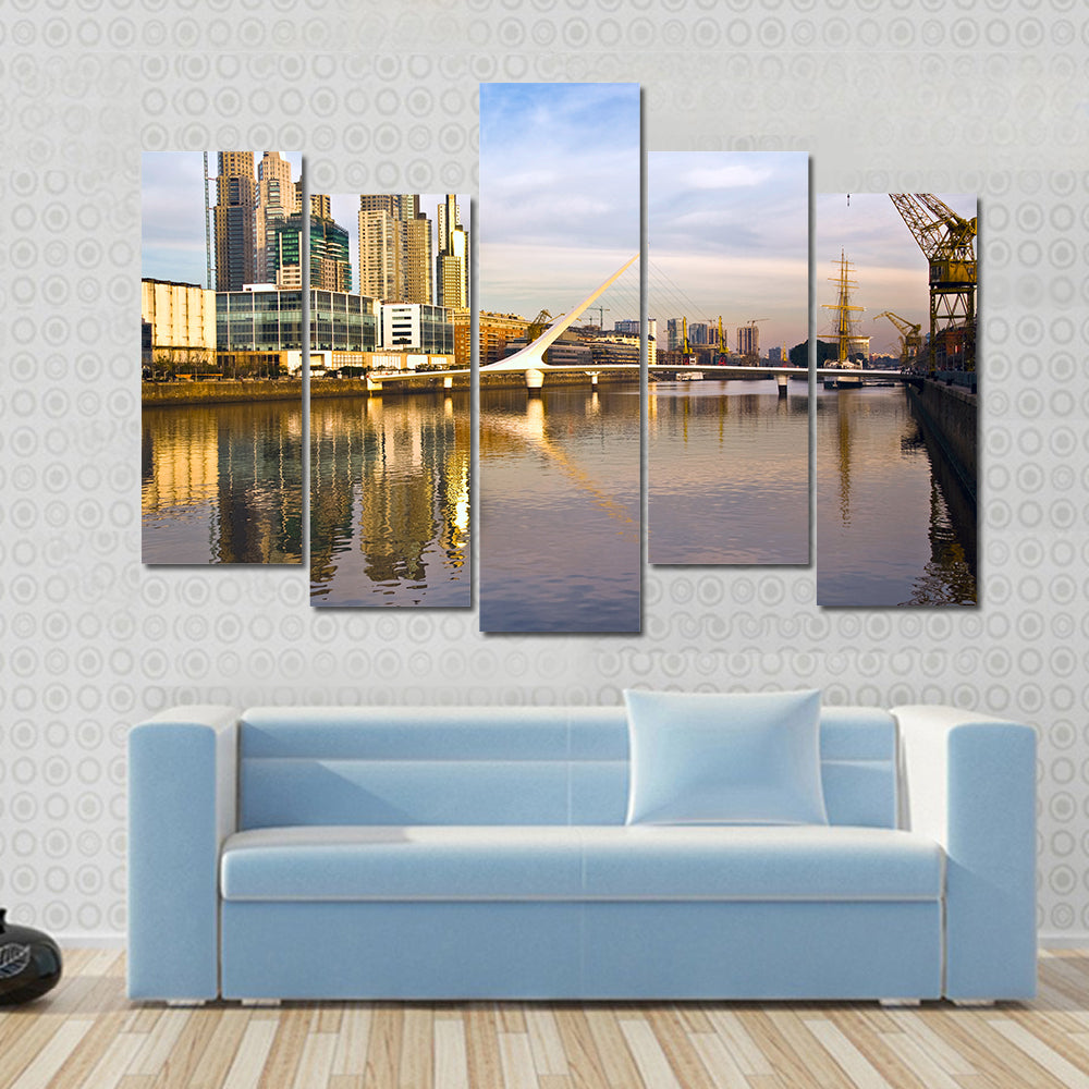 Scene Of A Lake Flowing In Front Of Yellow Building Multi Panel Canvas Wall Art