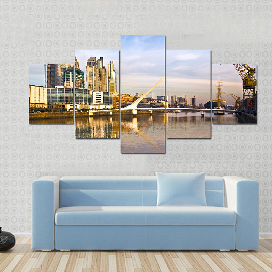 Scene Of A Lake Flowing In Front Of Yellow Building Multi Panel Canvas Wall Art