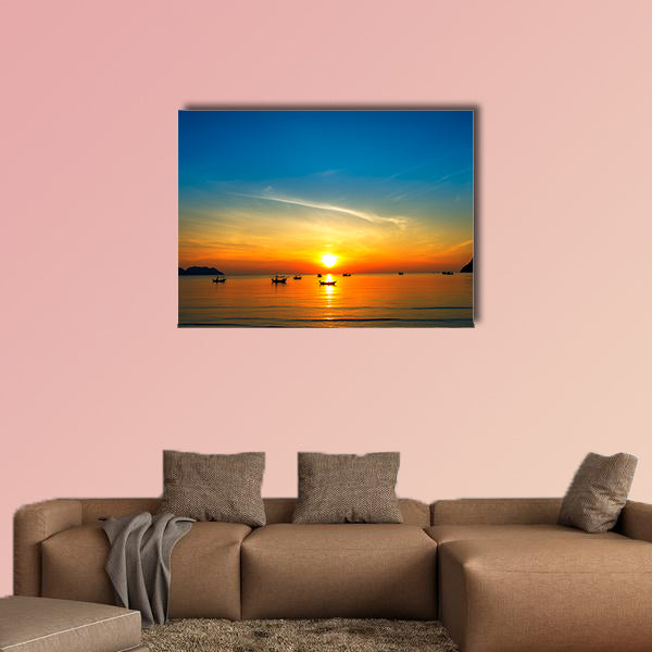 Silhouette of fisher man's boats on the tropical sea with colorful sunrise wall art