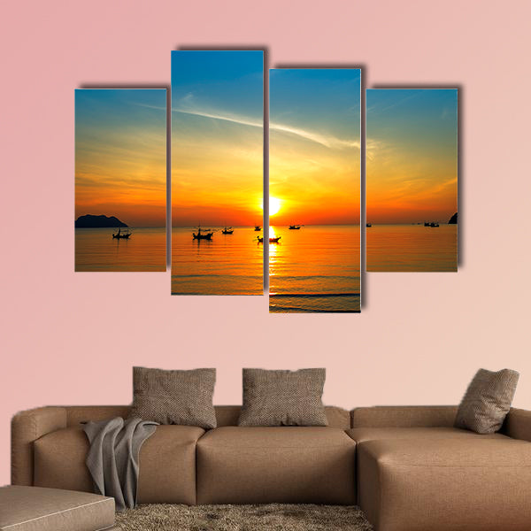 Silhouette of fisher man's boats on the tropical sea with colorful sunrise wall art