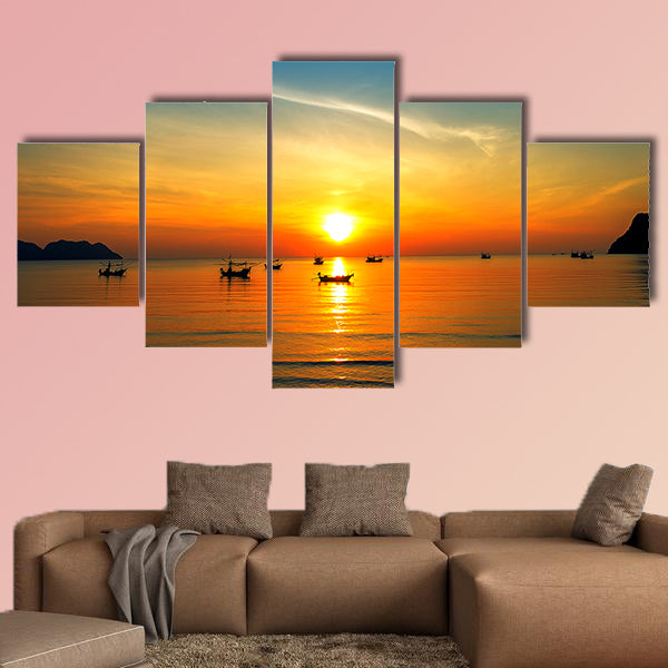 Silhouette of fisher man's boats on the tropical sea with colorful sunrise wall art