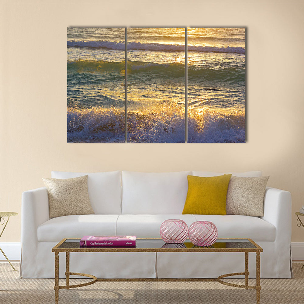 Ocean waves at sunrise in Miami Beach Florida. Sun shines on ocean waves in the morning Multi Panel Canvas Wall Art
