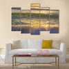 Ocean waves at sunrise in Miami Beach Florida. Sun shines on ocean waves in the morning Multi Panel Canvas Wall Art