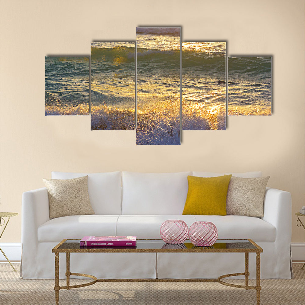 Ocean waves at sunrise in Miami Beach Florida. Sun shines on ocean waves in the morning Multi Panel Canvas Wall Art