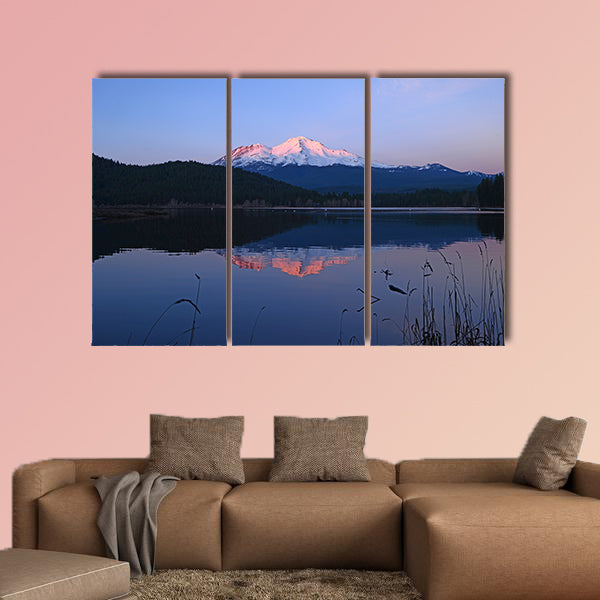 A reflection of Mount Shasta over a lake during sunset Multi panel canvas wall art