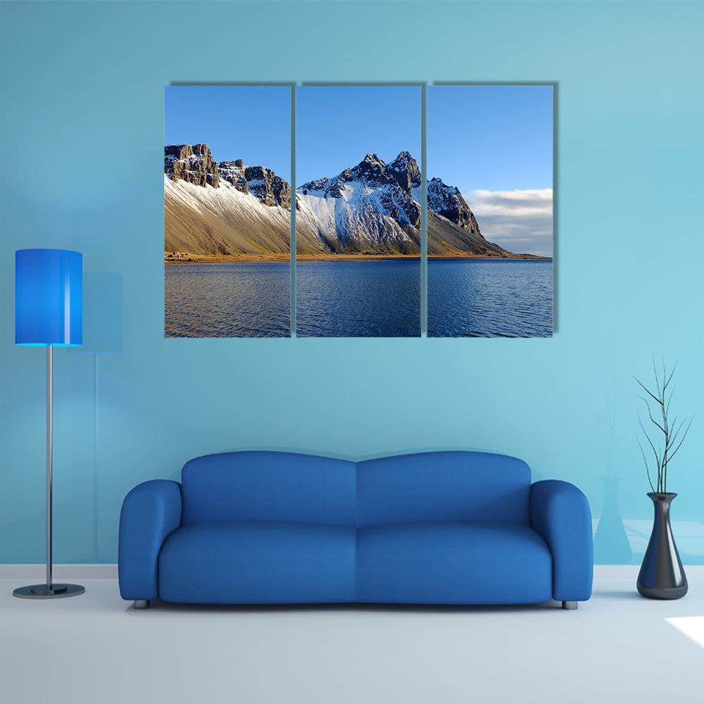 Cliff beside lake in Iceland multi panel canvas wall art