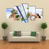 Woman and man having fun in volley ball game in summer Multi panel canvas wall art