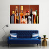 Bottles and glasses of assorted alcoholic beverages Multi panel canvas wall art