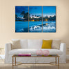 Tropical beach with palm trees and resort lights at night low tide multi panel canvas wall art