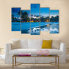 Tropical beach with palm trees and resort lights at night low tide multi panel canvas wall art