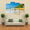 Amazing view of exotic sandy beach with high palm trees Multi panel canvas wall art