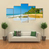 Amazing view of exotic sandy beach with high palm trees Multi panel canvas wall art