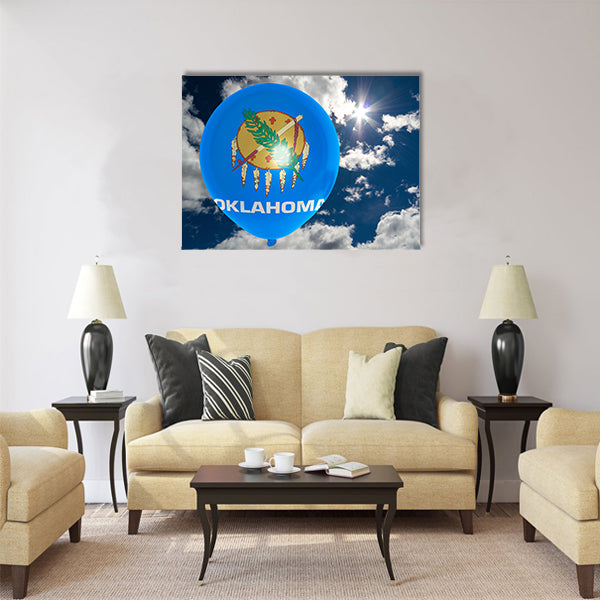 Balloon in colors of oklahoma flag flying on blue sky Multi panel canvas wall art