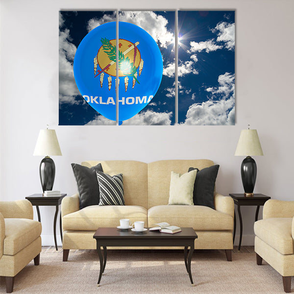 Balloon in colors of oklahoma flag flying on blue sky Multi panel canvas wall art
