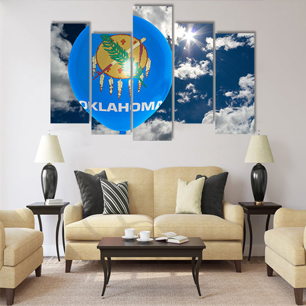 Balloon in colors of oklahoma flag flying on blue sky Multi panel canvas wall art
