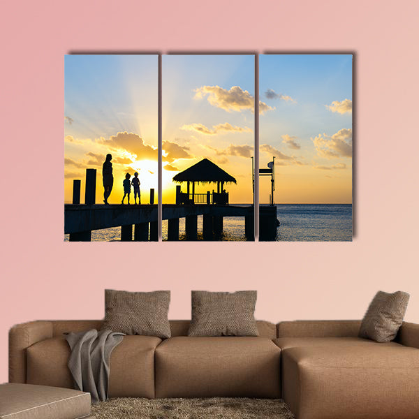 Family of mother and kids silhouettes at tropical coast wall art