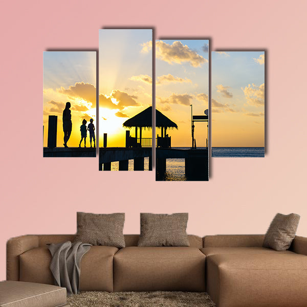 Family of mother and kids silhouettes at tropical coast wall art