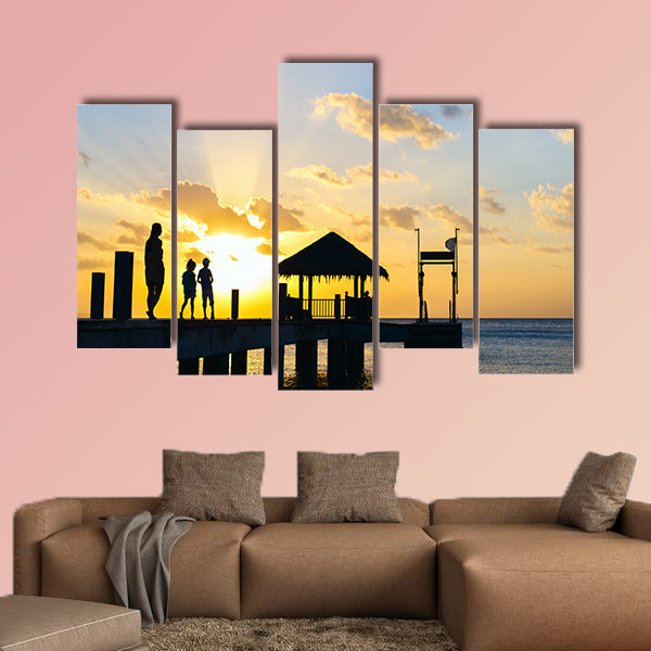 Family of mother and kids silhouettes at tropical coast wall art