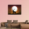 Silhouette of a deer standing on a hill at night multi panel canvas wall art