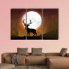 Silhouette of a deer standing on a hill at night multi panel canvas wall art