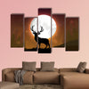 Silhouette of a deer standing on a hill at night multi panel canvas wall art