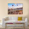 Hot air balloon flying over rock landscape at Cappadocia Turkey, multi panel canvas wall art