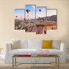 Hot air balloon flying over rock landscape at Cappadocia Turkey, multi panel canvas wall art