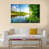 Trees by calm river in the morning Multi Panel Canvas Wall Art