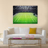 Grass tennis court and stadium full of spectators Multi panel canvas wall art