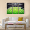 Grass tennis court and stadium full of spectators Multi panel canvas wall art