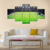 Grass tennis court and stadium full of spectators Multi panel canvas wall art