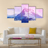 Beautiful cloudy sunrise in the mountains with snow ridge Multi panel canvas wall art