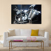 Motorbike with big exhaust pipe against a dark background Multi panel canvas wall art