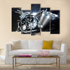 Motorbike with big exhaust pipe against a dark background Multi panel canvas wall art