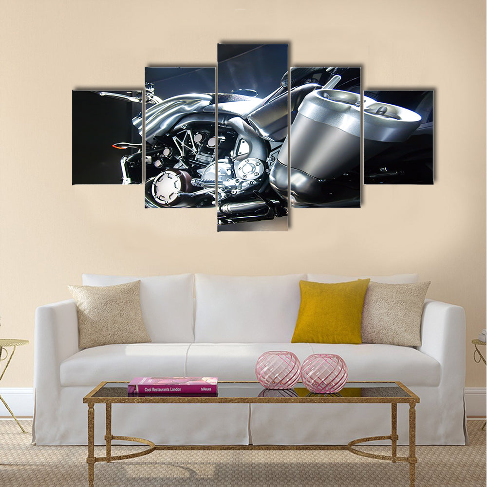 Motorbike with big exhaust pipe against a dark background Multi panel canvas wall art