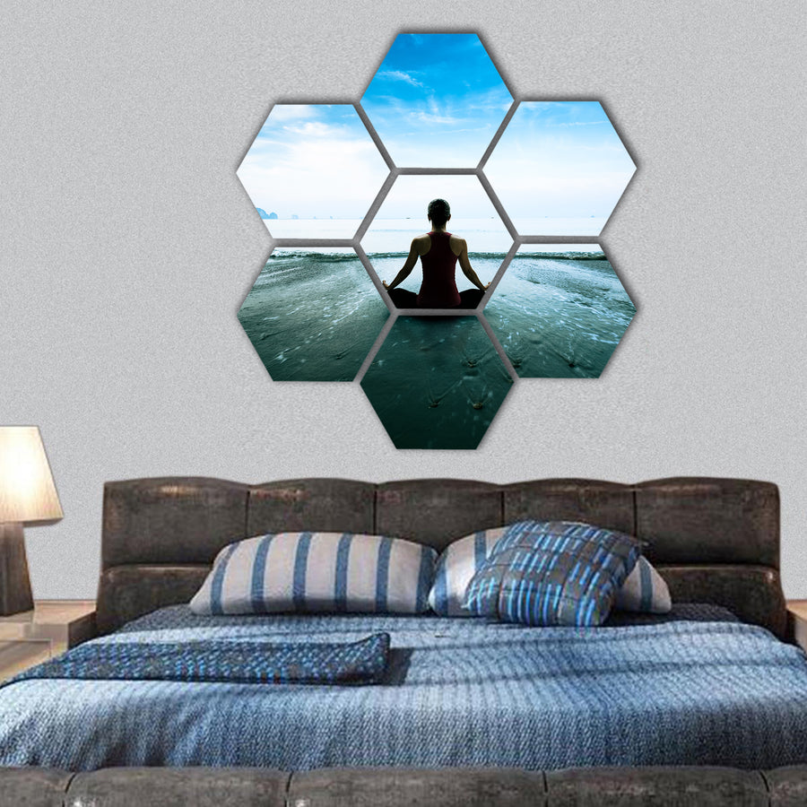 Silhouette young woman practicing yoga on the beach hexagonal canvas wall art