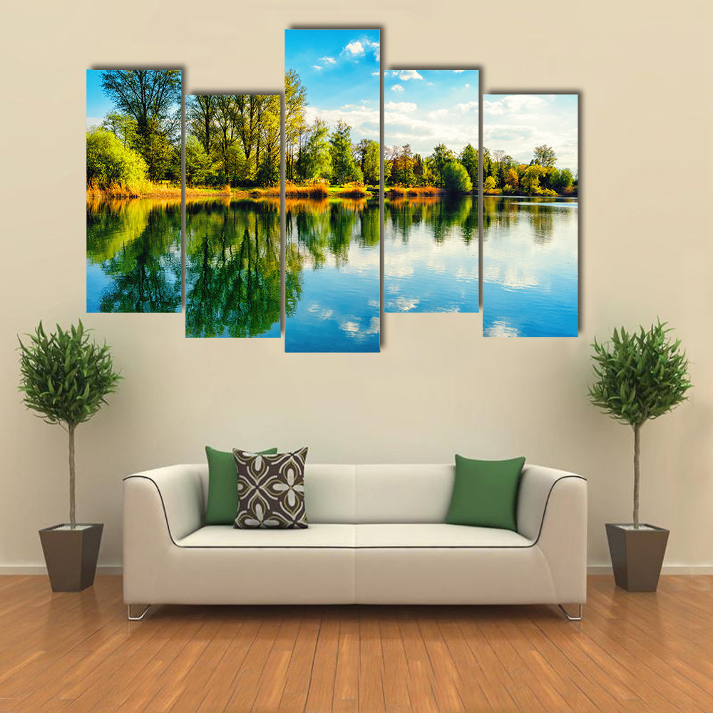Tranquil landscape at a lake, with the vibrant sky multi panel canvas wall art