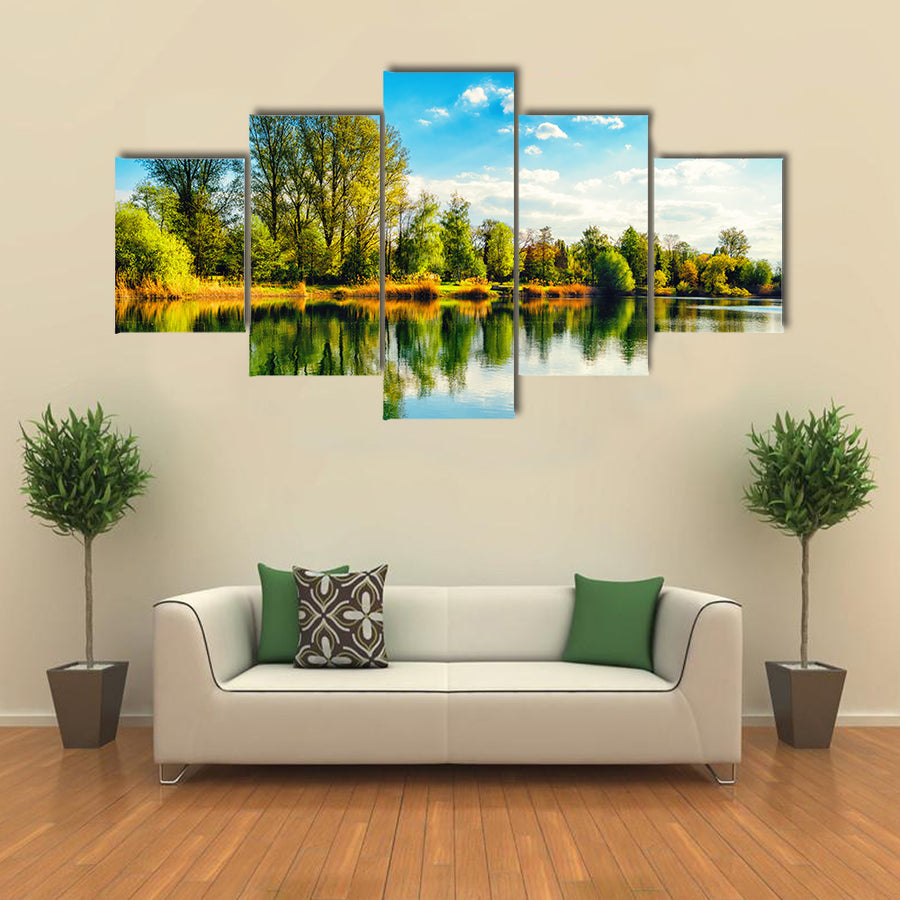 Tranquil landscape at a lake, with the vibrant sky multi panel canvas wall art