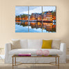 Night city view of Amsterdam, the Netherlands with Amstel river Multi panel canvas wall art