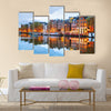 Night city view of Amsterdam, the Netherlands with Amstel river Multi panel canvas wall art