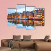 Night city view of Amsterdam, the Netherlands with Amstel River multi panel canvas wall art