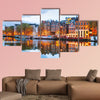 Night city view of Amsterdam, the Netherlands with Amstel River multi panel canvas wall art